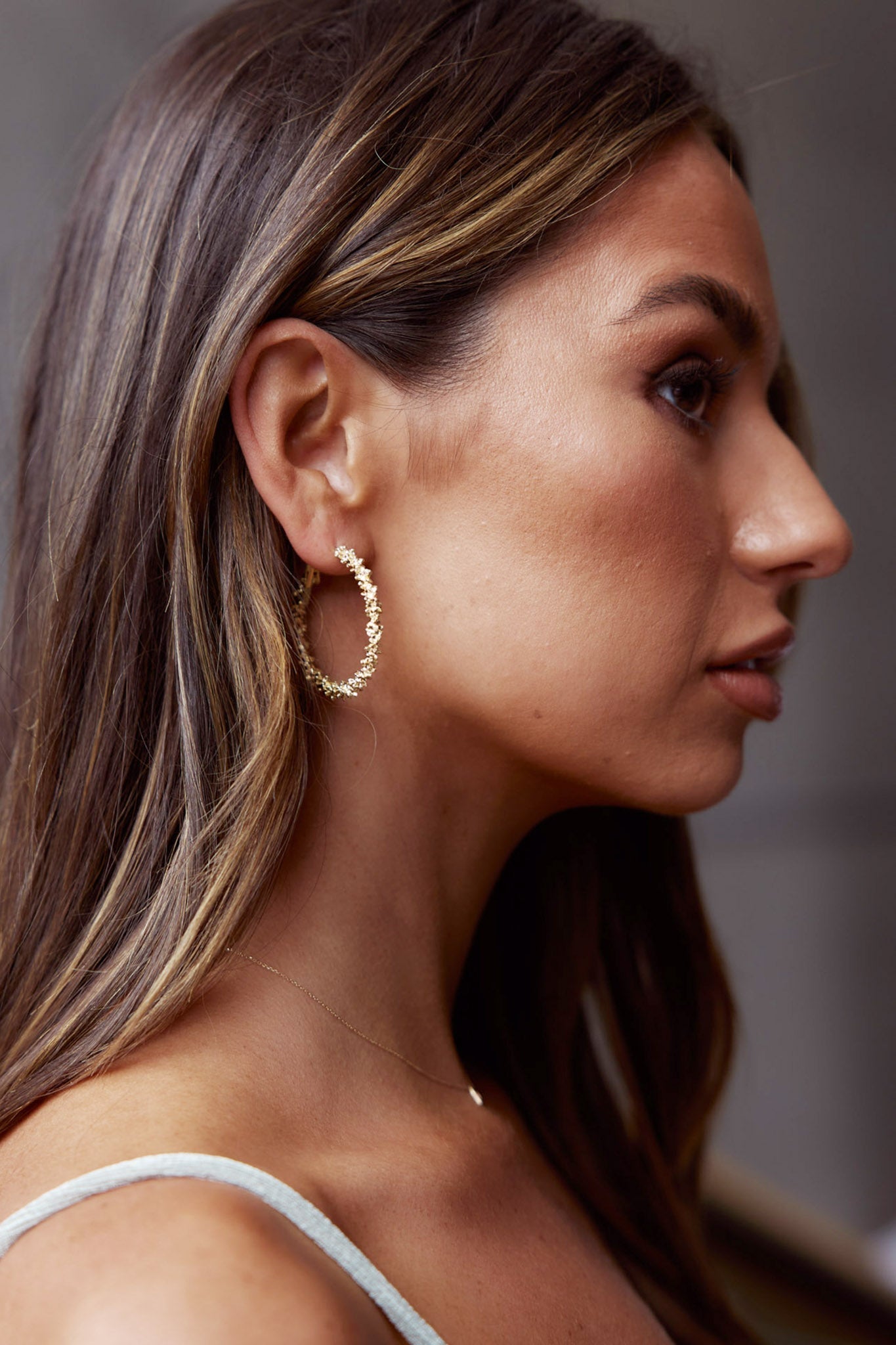 Layered Saturn texture earrings in gold