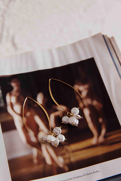 Long hook earrings with gold pearl accents