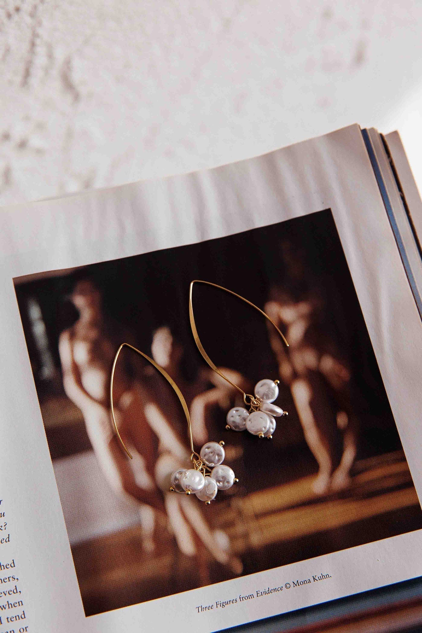 Long hook earrings with gold pearl accents