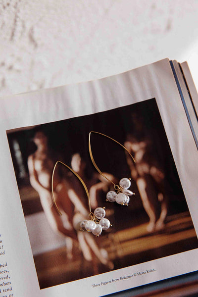 Long hook earrings with gold pearl accents