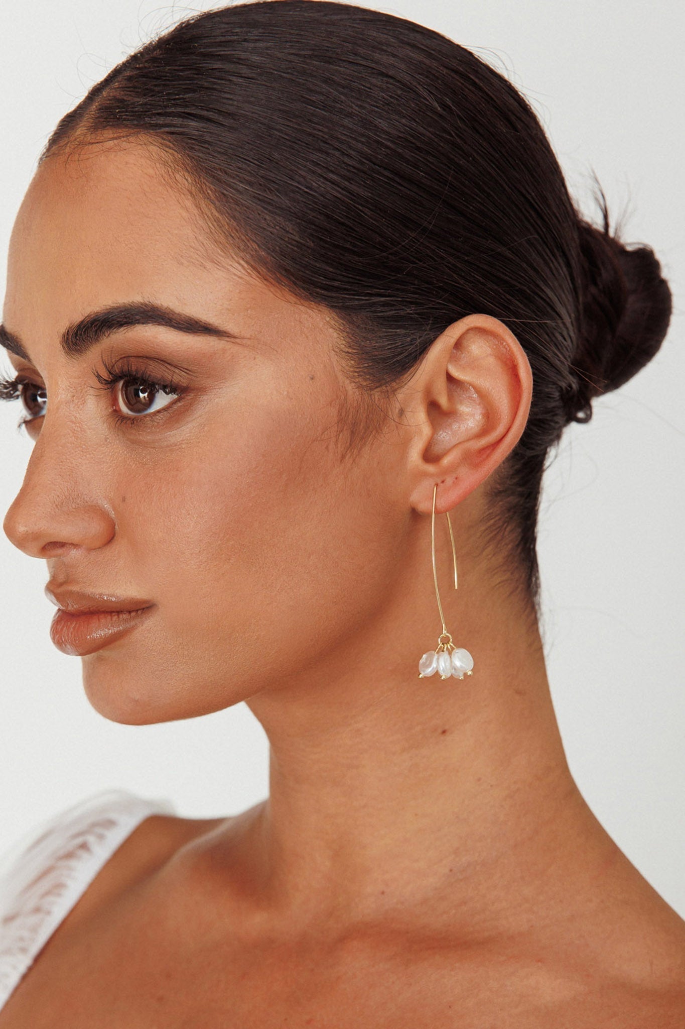 Long hook earrings with gold pearl accents